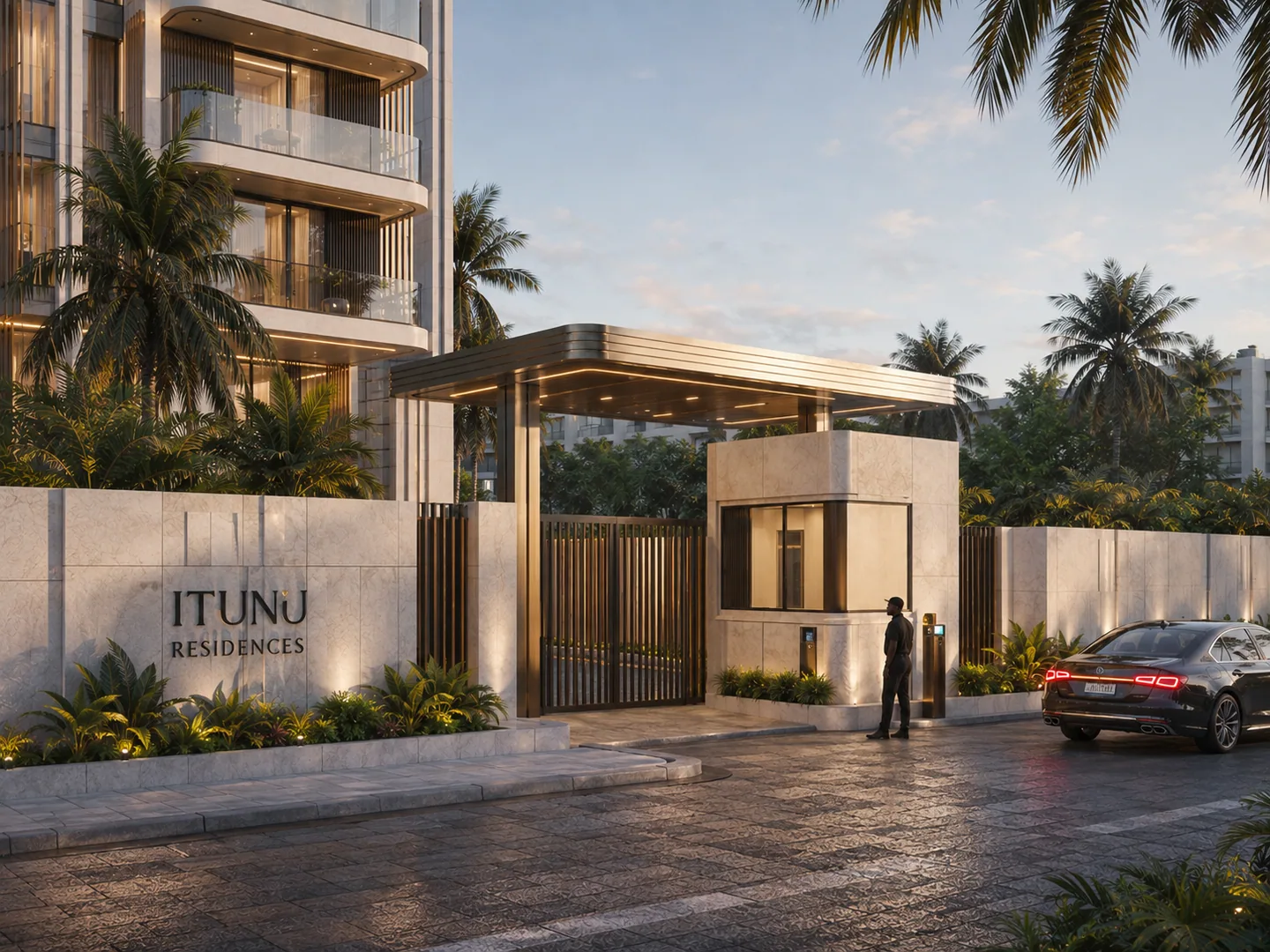 Vehicle entrance gate with security cabin, 'ITUNU RESIDENCES' wall signage, security guard standing at the gate, arriving car.